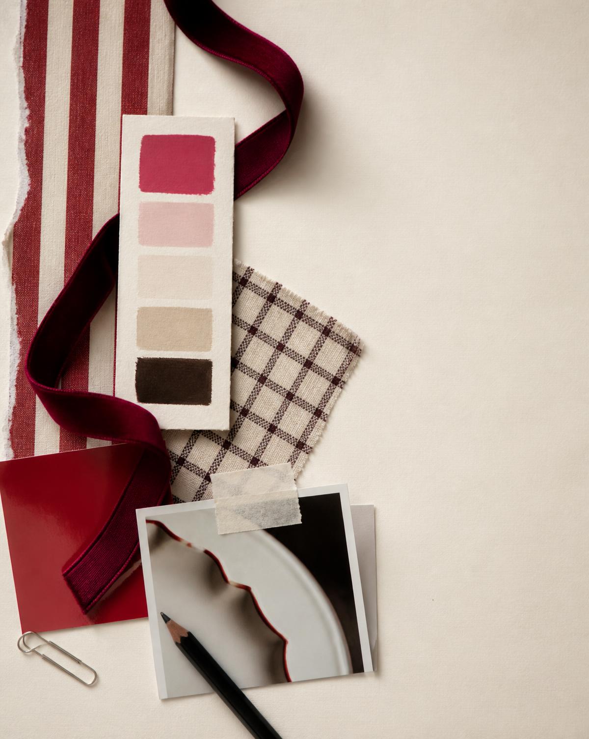 Striped paper, velvet ribbon, a painted swatch card and a checked cotton sample